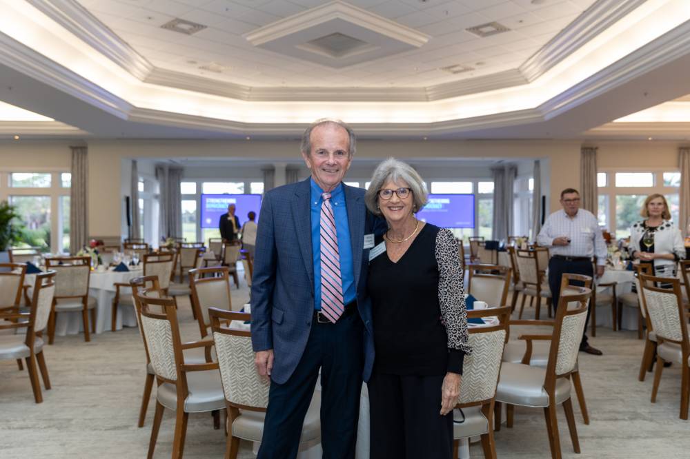 Norman and Anita Christopher standing together and posing for camera